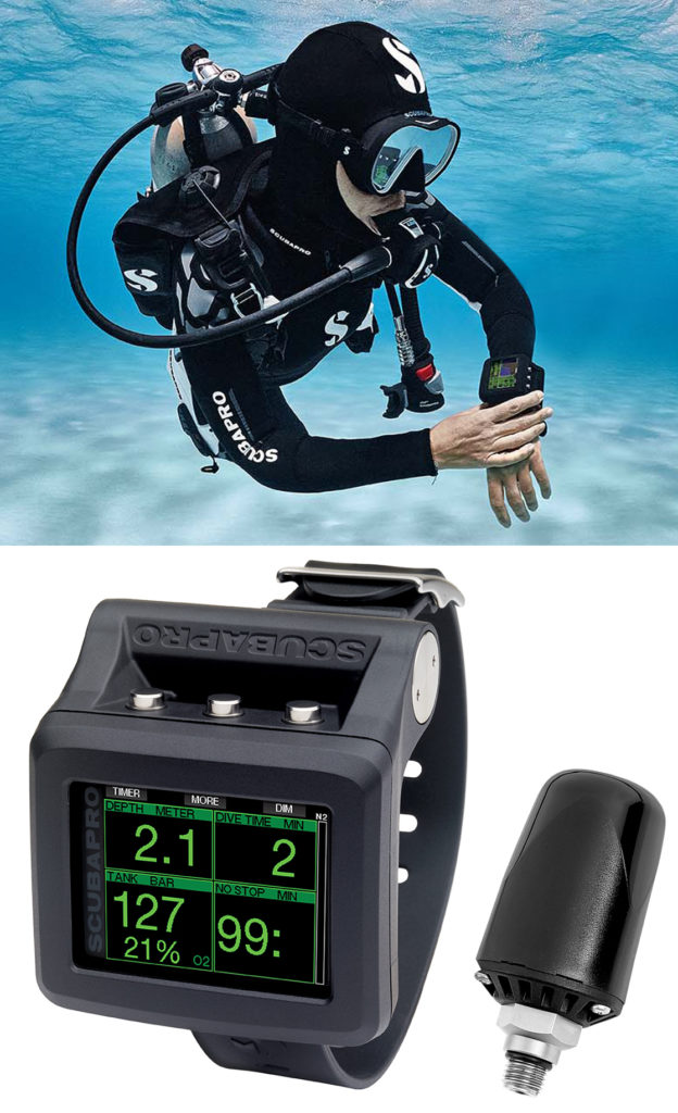 Diver underwater holding the Scubapro G2 Dive Computer