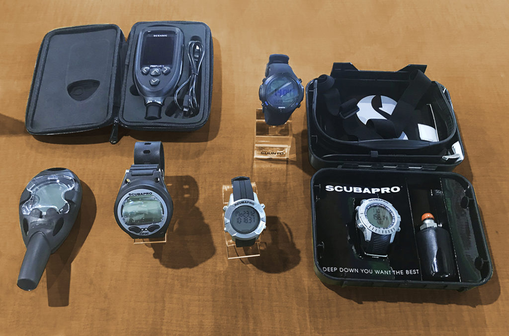 Flat lay image of different dive computers
